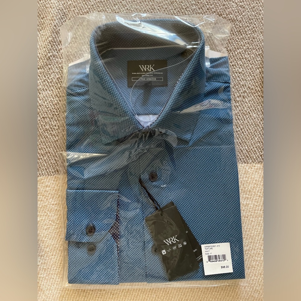 Never worn men’s blue shirt. Still in original packaging with tags!